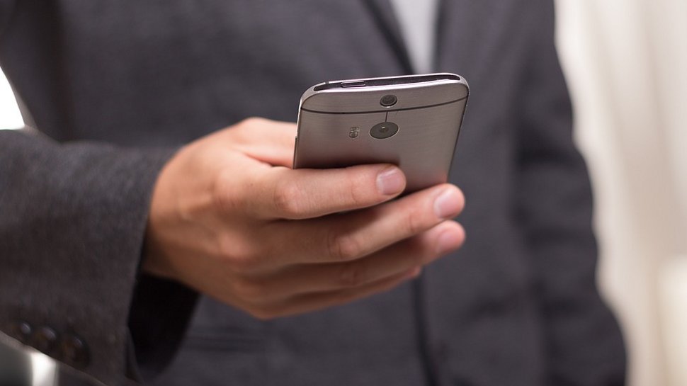 Close -up of a business person using a smartphone.