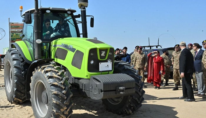 Coas Gen Asim Munir inspects a tractor showcased at the launch ceremony for the Green Pakistan initiative in Cholistan on February 15, 2025. - Pakinomist News