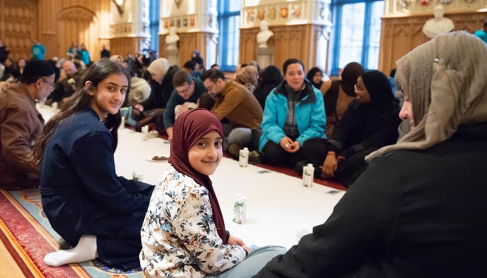 Children move as they participate in the first open Iftar in Windsor Castles State Apartments. - Reporter