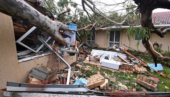 Waste lies in a damaged house of a fallen chewing gum in front of the tropical cyclone Alfreds Landfall, at Mudgeeraba on Gold Coast, Australia, March 7, 2025. - Reuters