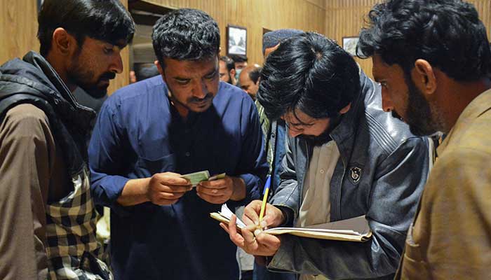 Passengers rescued from a train after it was attacked by militants will be registered at the railway station in Quetta, Balochistan, March 12, 2025. - Reuters 