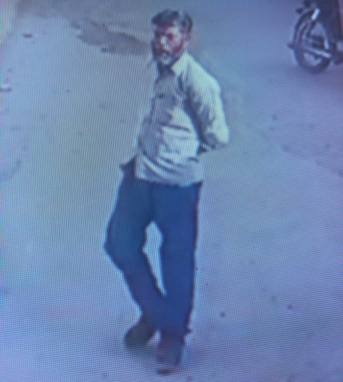 Still from CCTV recordings of the suspect outside the police station. - Reporter
