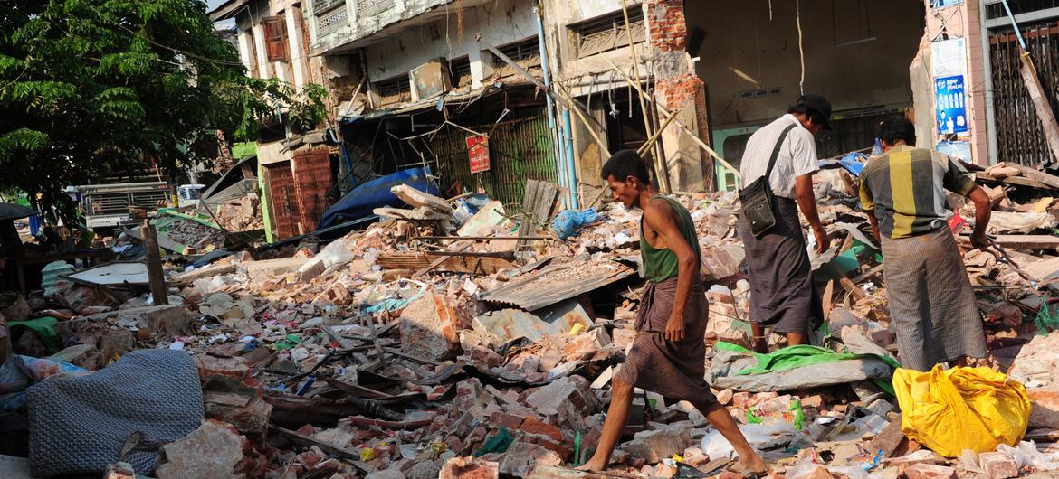 Survivors on earthquakes investigate the ruins of their homes in Pyinmana, Myanmar after the earthquake there. Survivors on earthquakes investigate the ruins of their homes in Pyinmana, Myanmar after the earthquake there.