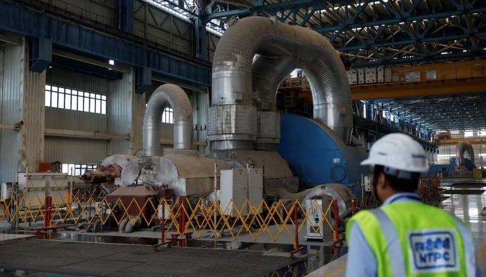 An employee is seen inside the NTPC (National Thermal Power Corporation) power plant in Solapur, India, March 2, 2025. - Reuters