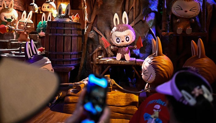 The character labubu in an exhibition hall when people visit Pop Mart -Temaparkpopland in Beijing, China on June 18, 2025. - AFP