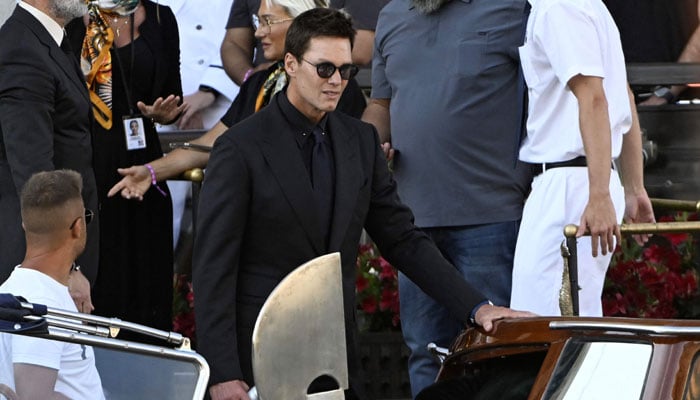 American footballer Tom Brady leaves the Gritti Palace Hotel on the wedding day of Amazon - founder Jeff Bezos with Lauren Sanchez, in Venice on June 27, 2025. - AFP