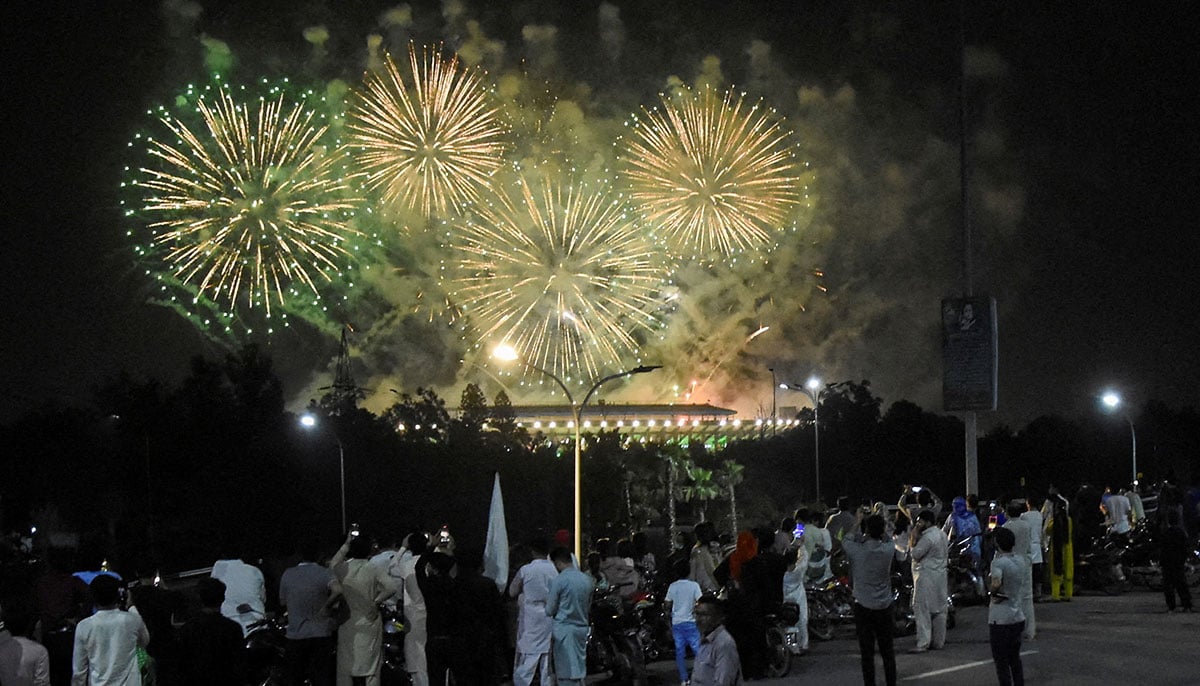 People see fireworks exploding during the celebration of Independence Day in Islamabad on August 14, 2025. - Reuters