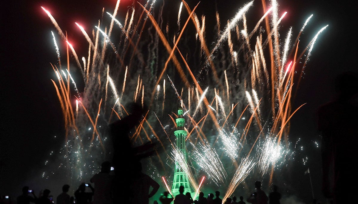 People see fireworks exploding over the enlightened Minar-E-Pakistan monument during the celebration of Independence Day in Lahore on August 14, 2025.-Reuters