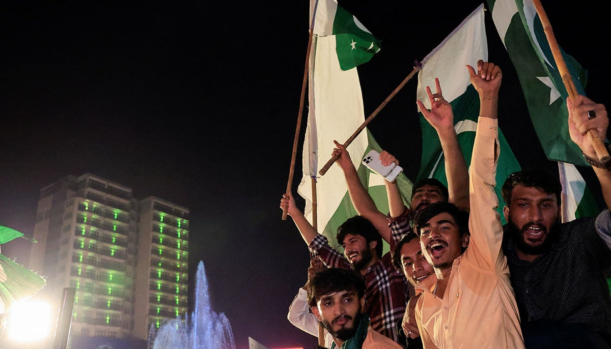 People sing slogans during Independence Day Celebration in Lahore on August 14, 2025. - Reuters