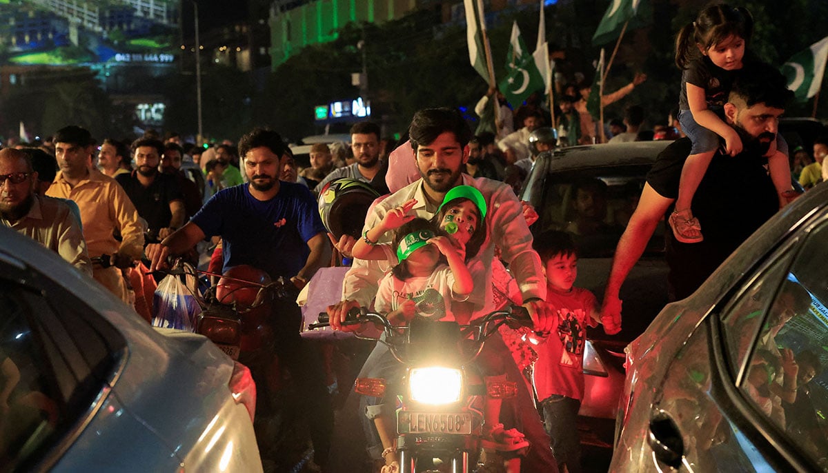People participate in the Day of Independence in Lahore on August 14, 2025. - Reuters