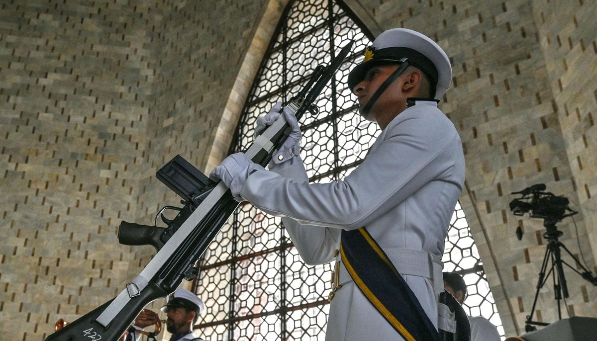 A Pakistani Navy -cadet stands guard at Mausoleum in Muhammad Ali Jinnah, during the Independence Day in Karachi on August 14, 2025. - AFP