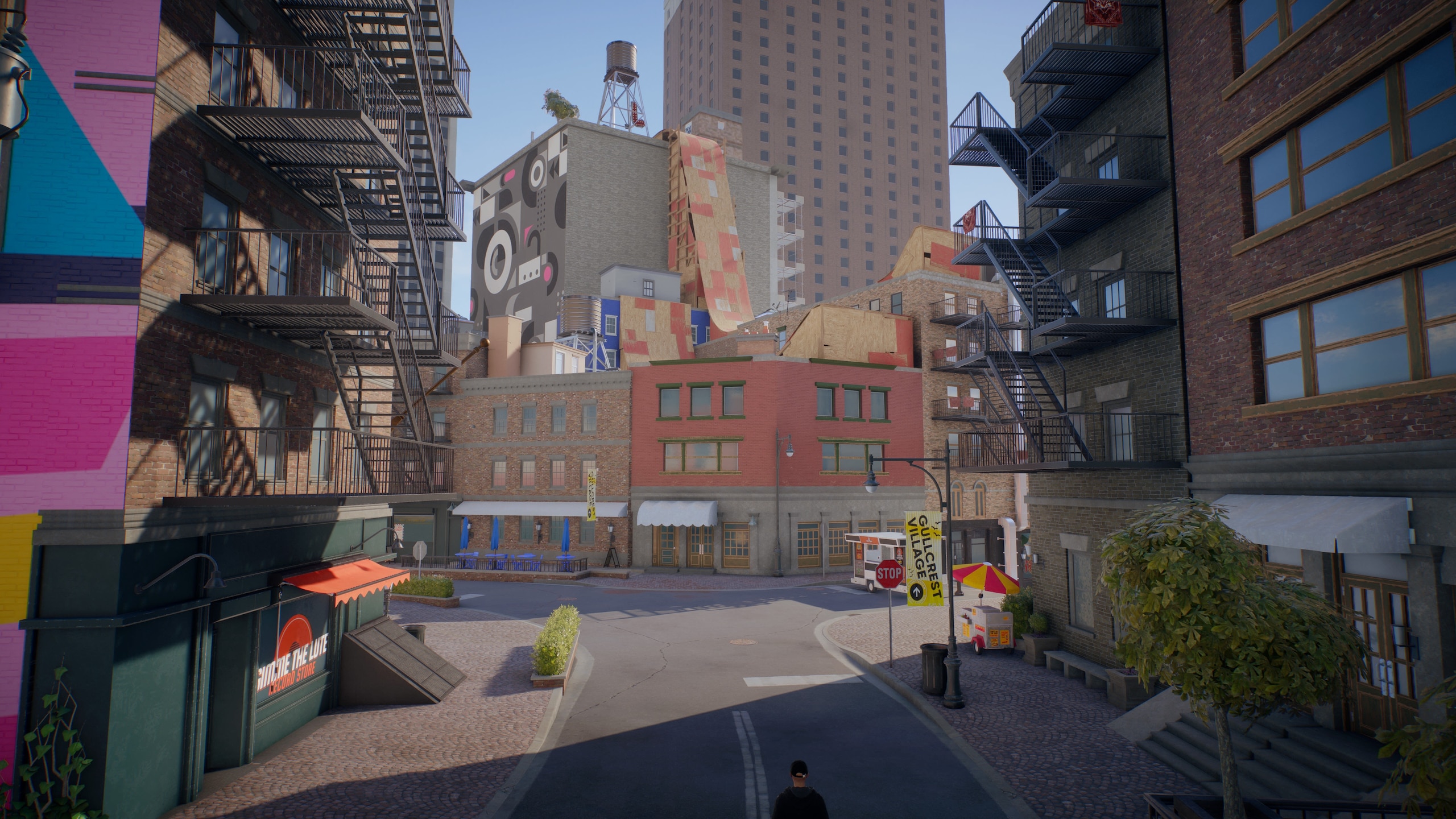 An area of ​​Sanvansterdam: Colorful buildings with large ramps on the roofs of the roofs and a skyscraper in the distance
