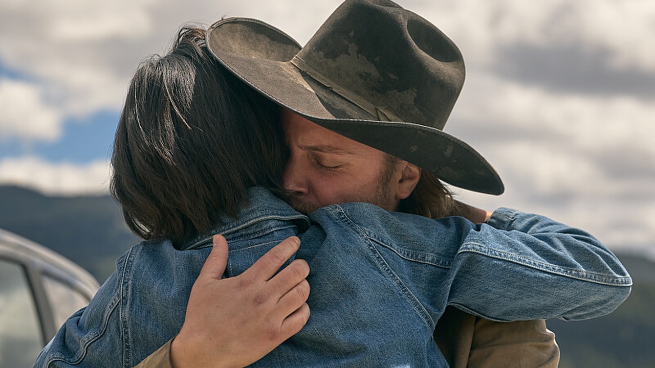 Kelsey Asbille like Monica Long and Luke Grimes as Kacey Dutton embraces in Yellowstone Season 5, Part 2