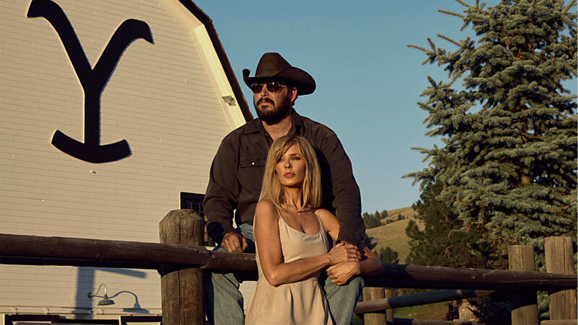 Rip Wheeler and Beth Dutton stand outside a ranch together in Yellowstone Season 5.
