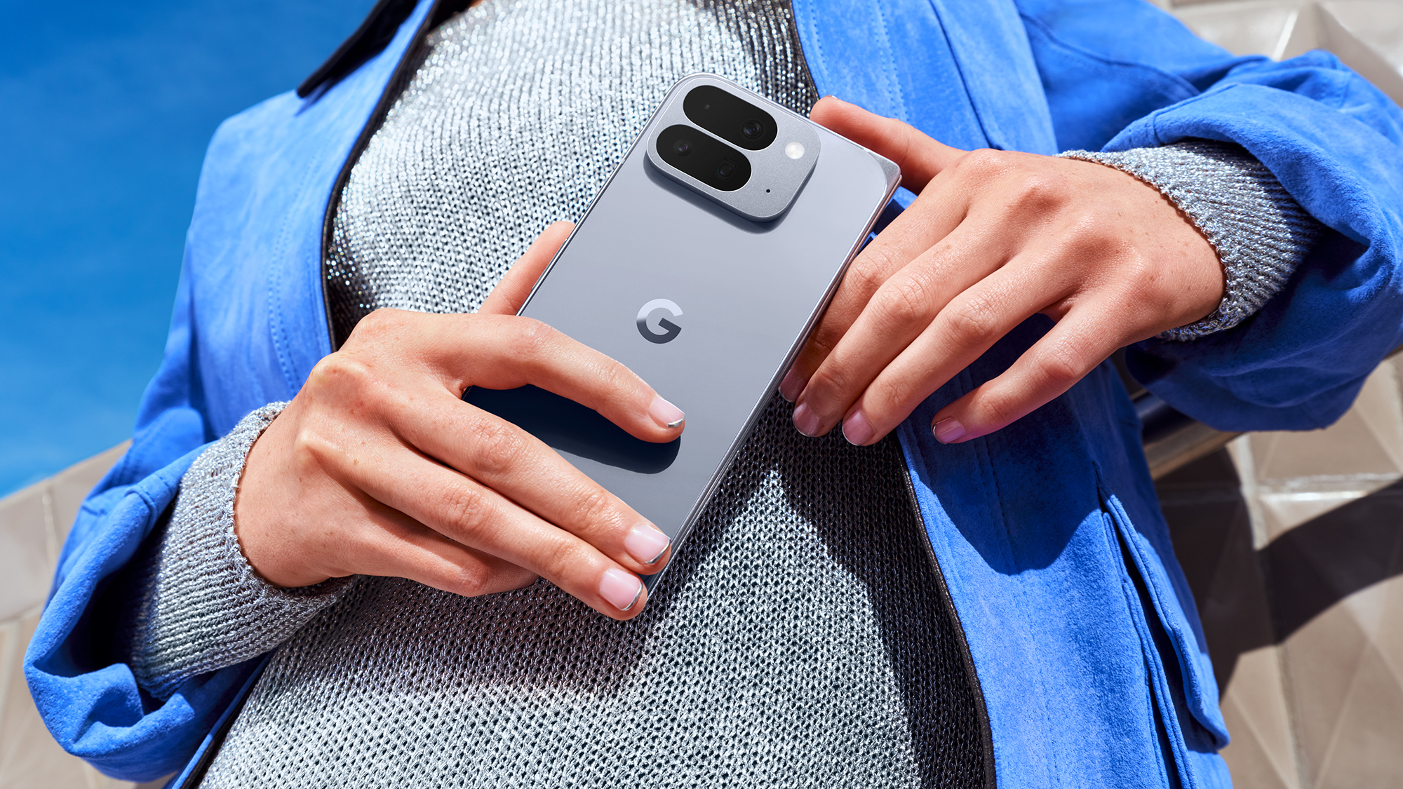 Two hands holding Google Pixel 10 Pro Fold Phone