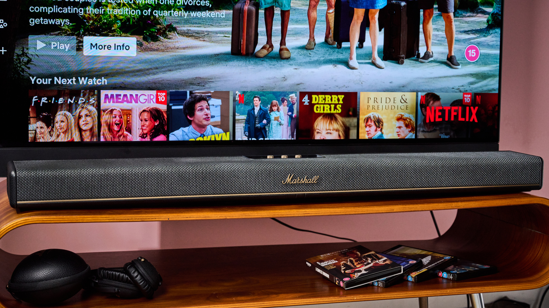 Marshall Heston 120 under TV with Marshall headphones and 4K UHD Blu rays under it