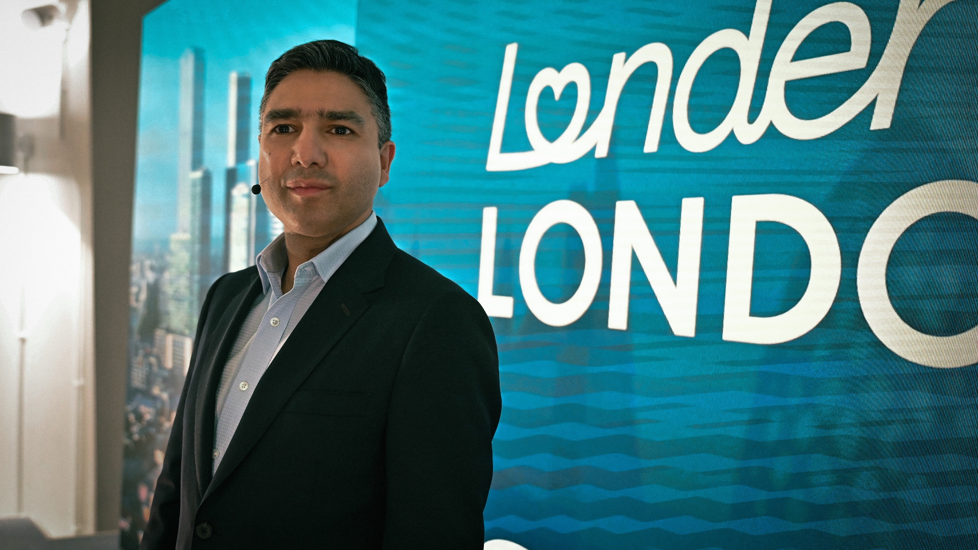 Nick Mohammed stands next to a sign in slow horses season 5