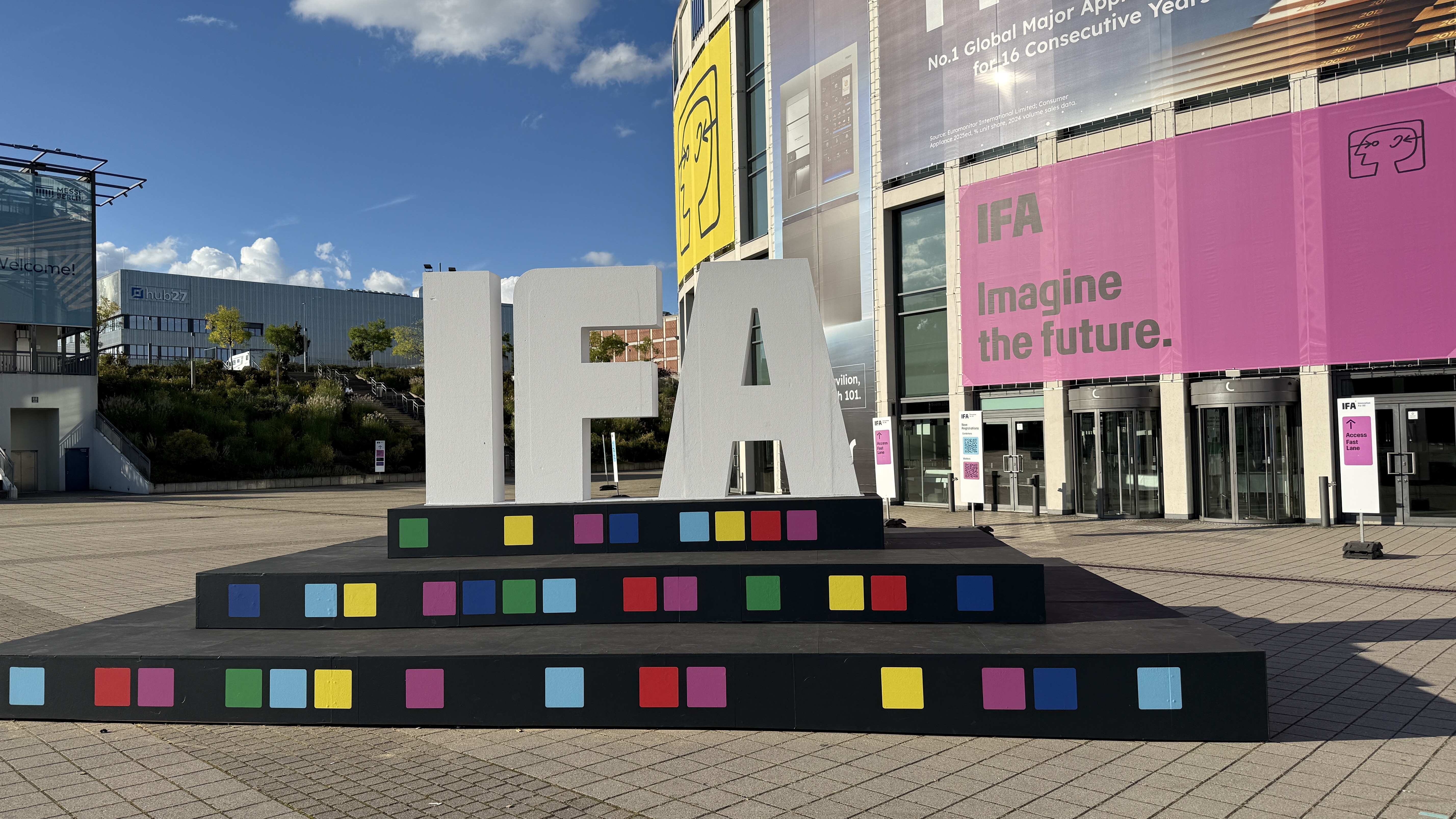 A sign of the IFA logo with the Messe Berlin complex in the background