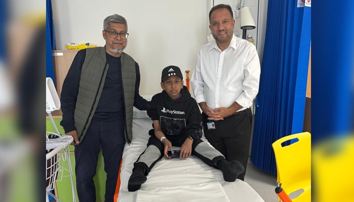 The British-Pakistani dr. Sher Bahadur Anjum (right), originally from Gilgit Baltistan, stands with a thalasemia patient after their successful gene therapy treatment. - Reporter