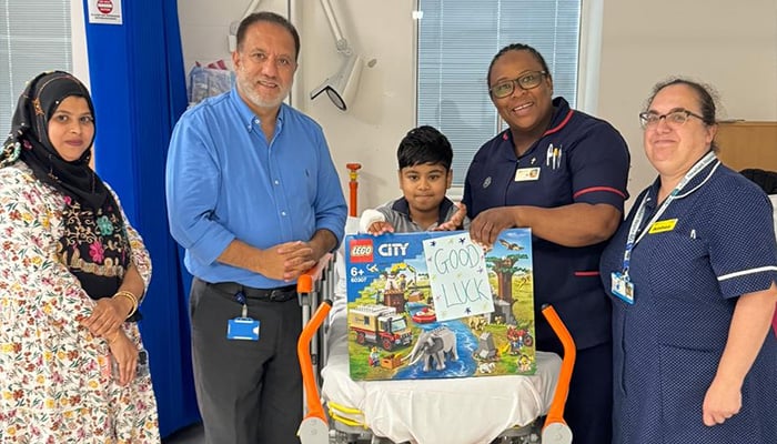 The British-Pakistani dr. Sher Bahadur Anjum (other from left), originally from Gilgit Baltistan, stands with a thalasemia patient after their successful gene therapy treatment. - Reporter