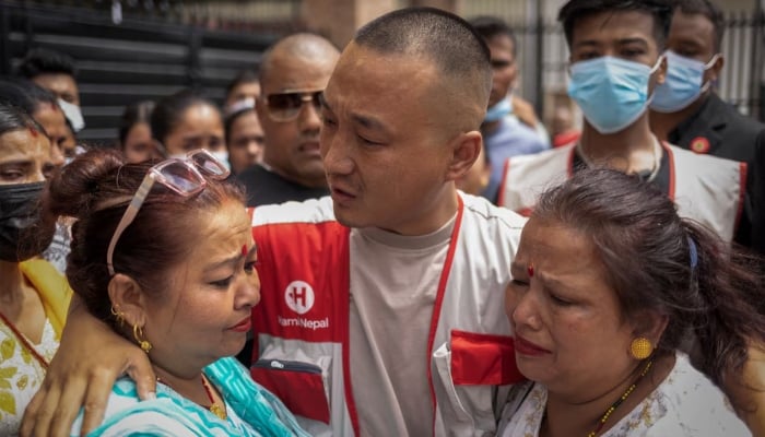 Sudan Gurung, 36, Founder of Hami Nepal, cries after meeting the family members of the victims who died after last weeks deadly anti-corruption protests, outside a Likhus in a hospital, in Kathmandu, Nepal, September 13, 2025.-Reuters