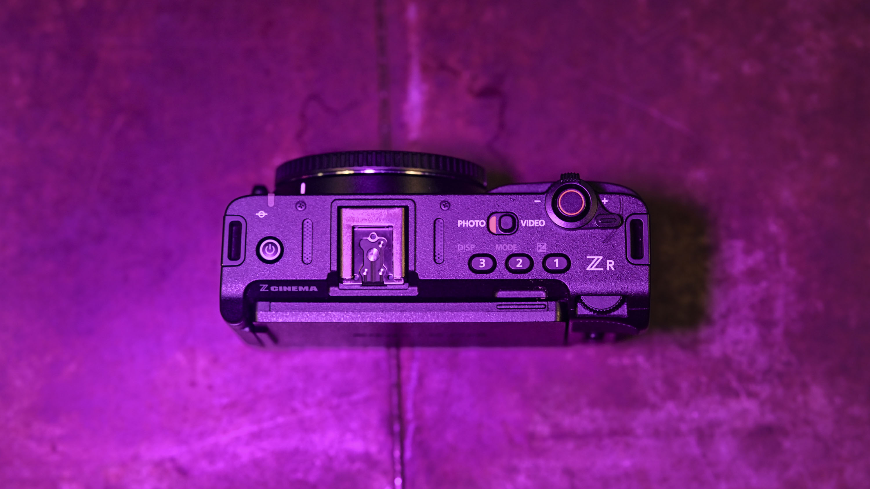 At the top of the Nikon ZR camera under low key Magenta lighting