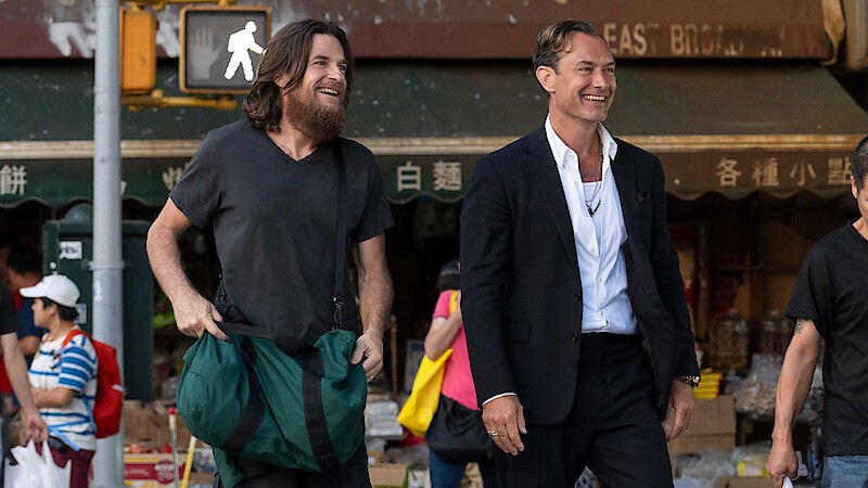 Jason Bateman and Jude Law smiles in black rabbit