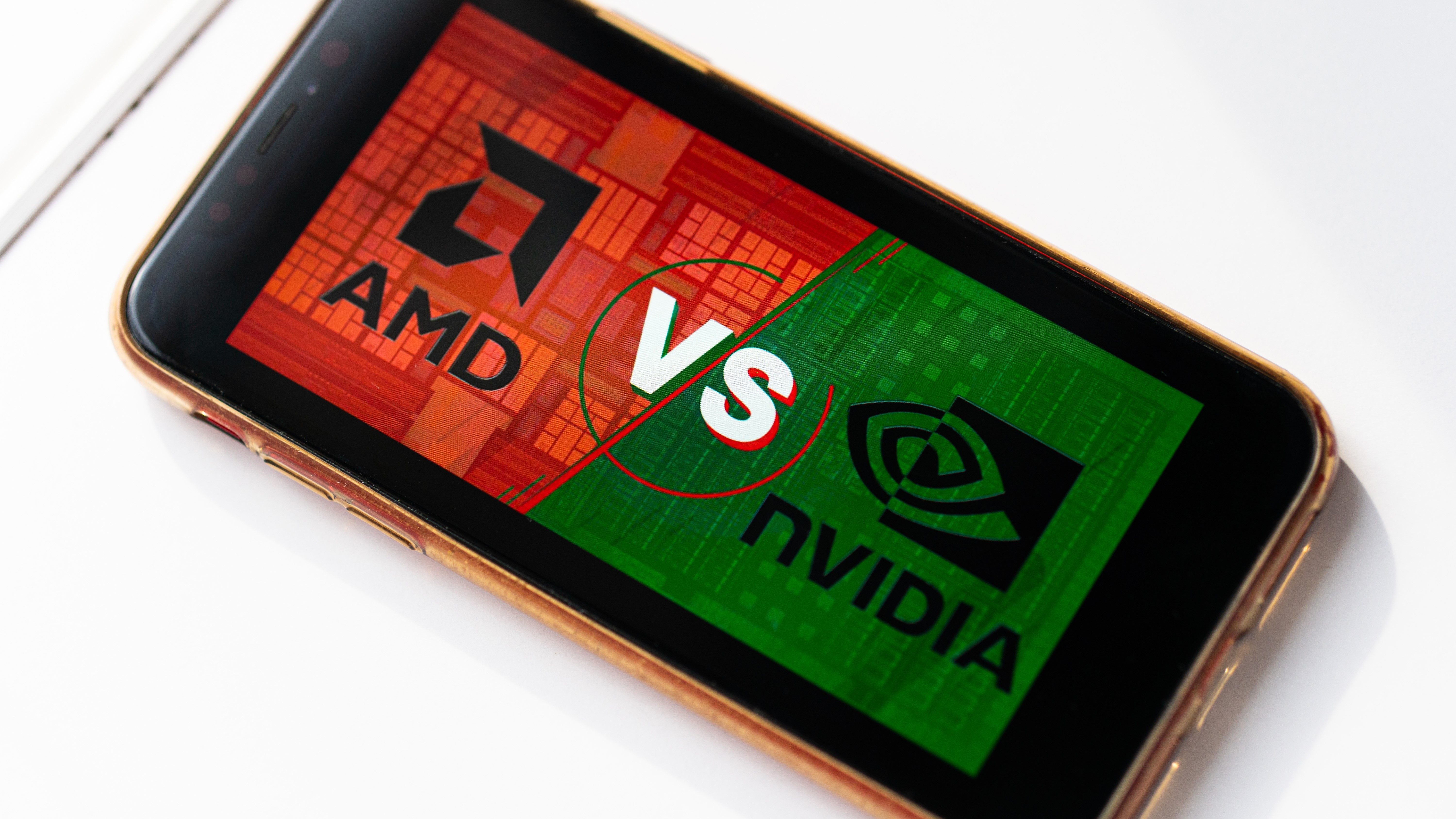 A smartphone that shows a red and green graphic on 'AMD vs nvidia'.