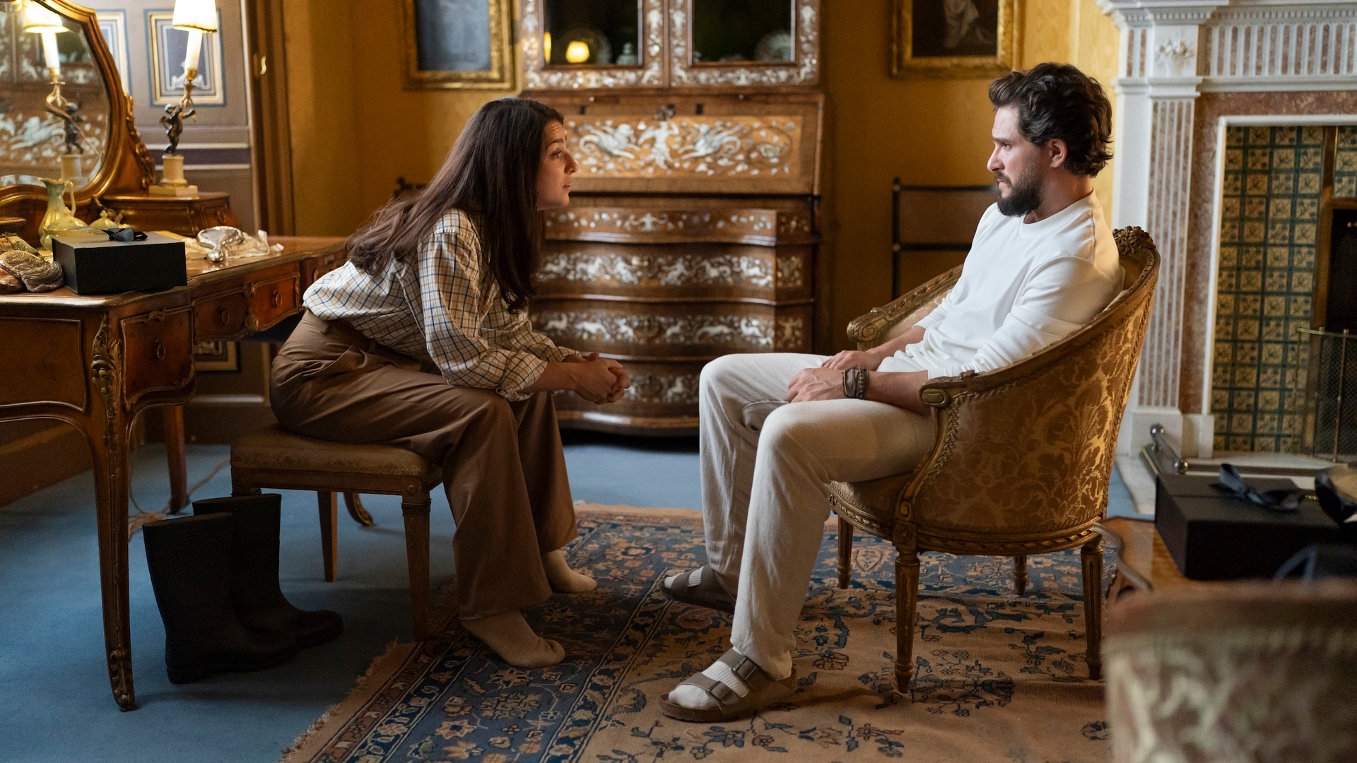 Yasmin leans forward toward Henry in the industry season 3