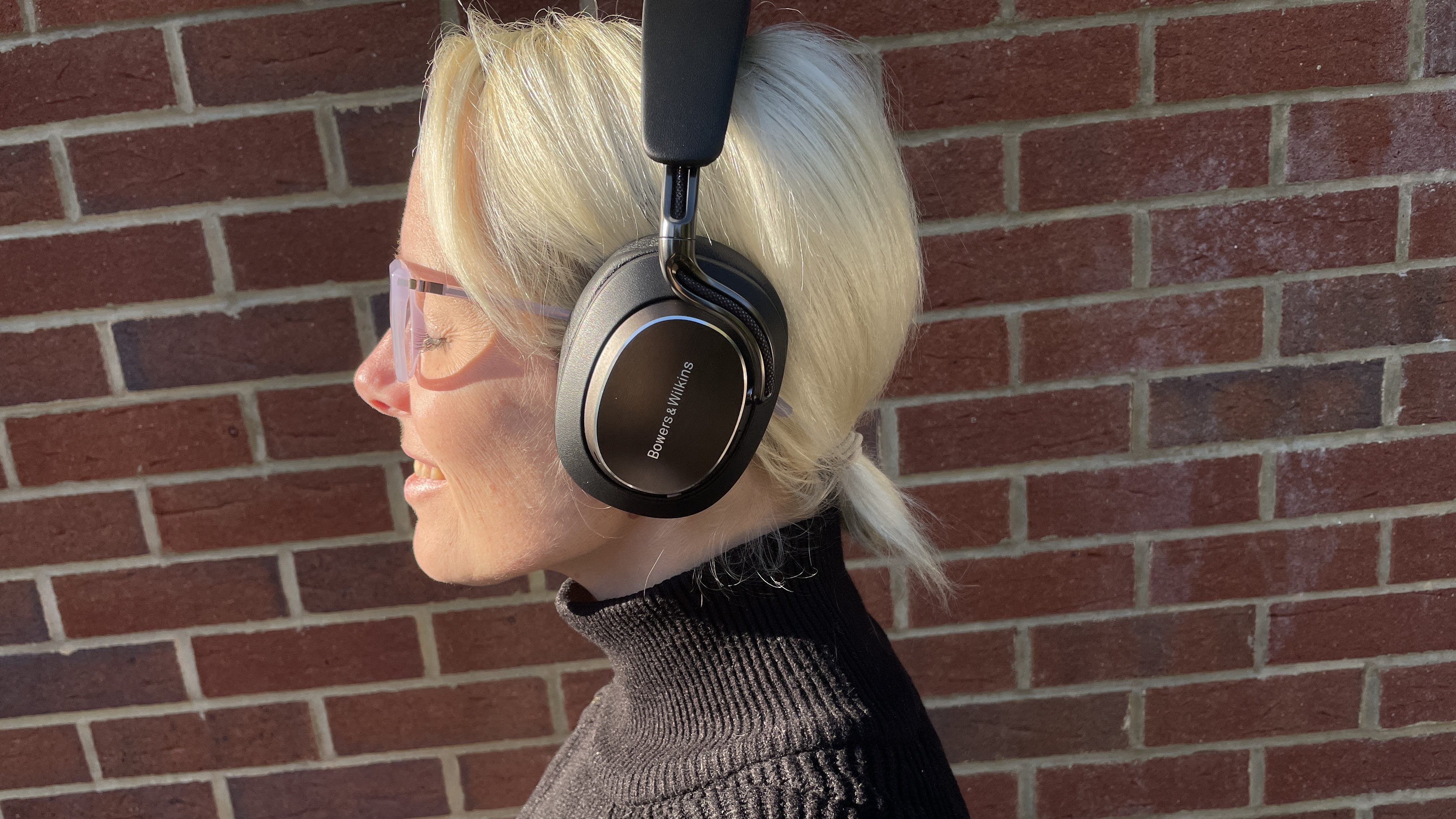 Bowers & amp; amp; Wilkins PX8 S2 in front of a red wall wall