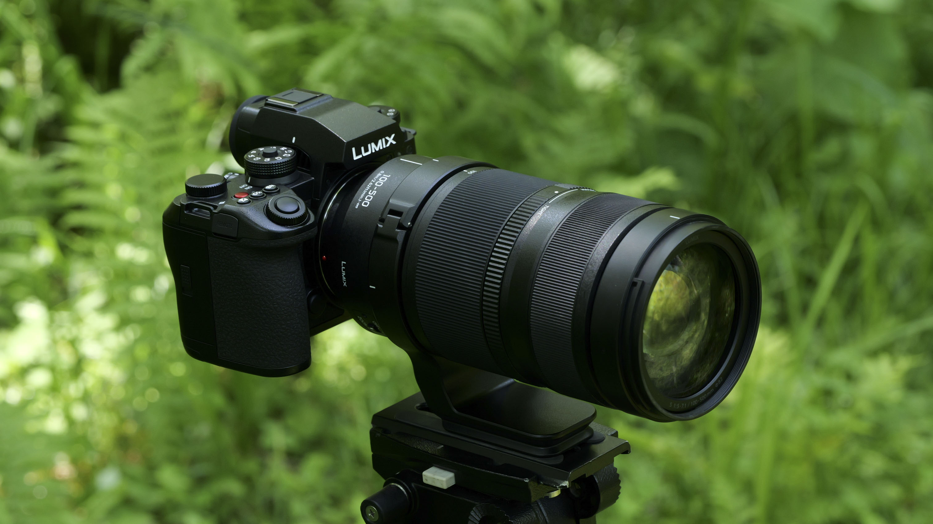 Panasonic Lumix S 100-500MM F5-7.1 OIS lens attached to a Lumix S1 II linked to a stand with background ferries