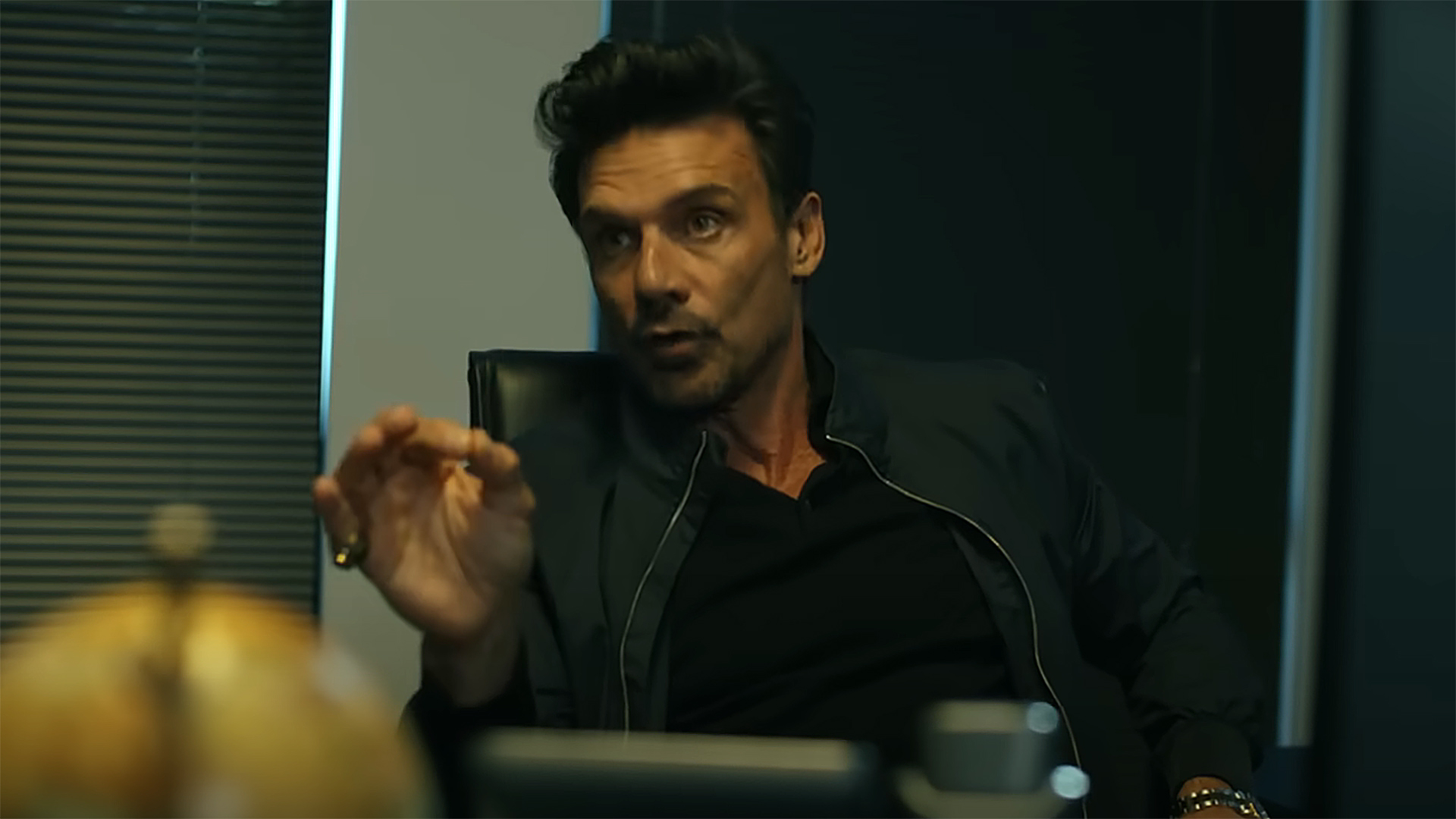 Rick Flag SR sits at its argus desk in Peacemaker season 2 section 6