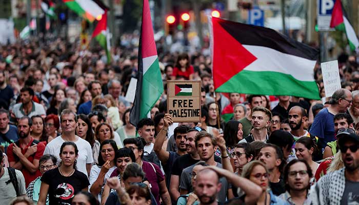 A demonstrator holds a sign that reads free Palestine during a protest in support of Palestinians, in Barcelona, ​​Spain, September 18, 2025. - Reuters