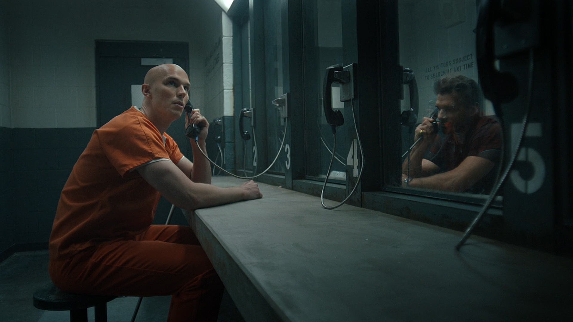 LEX LUTHOR LOOKS AROUND WHILE TALKED WITH RICK FLAG SR SR VIA A PRIRESS PHONE IN PEACEMAKER SEASON 2 SECTION 6