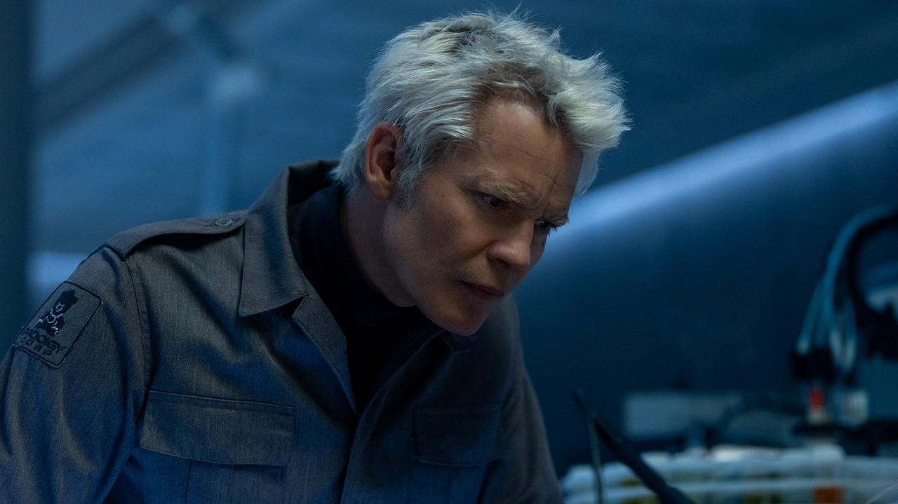 Kirsh leans over a table in Alien: Earth Season 1 Section 8