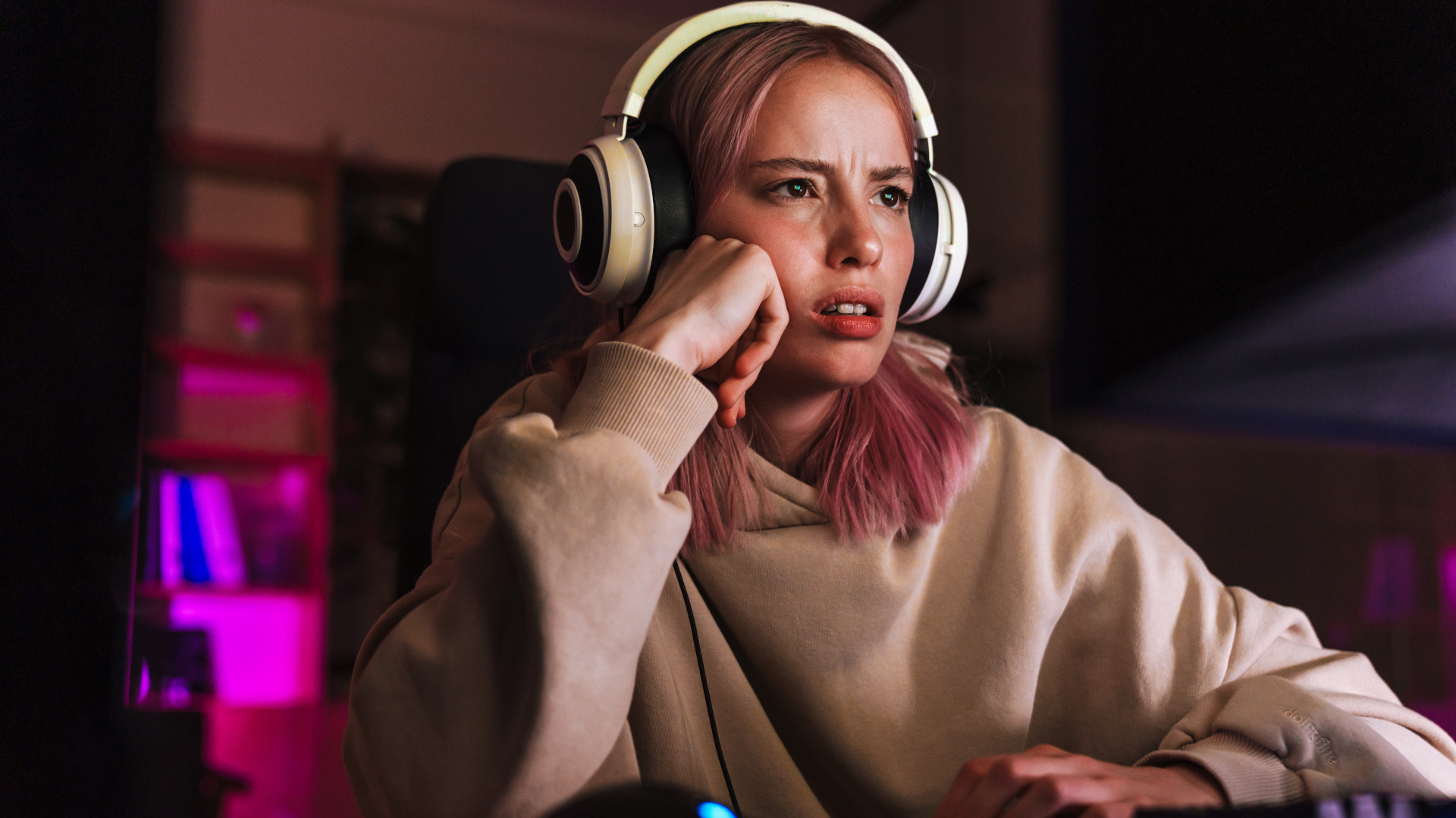 A frustrated girl playing a video game