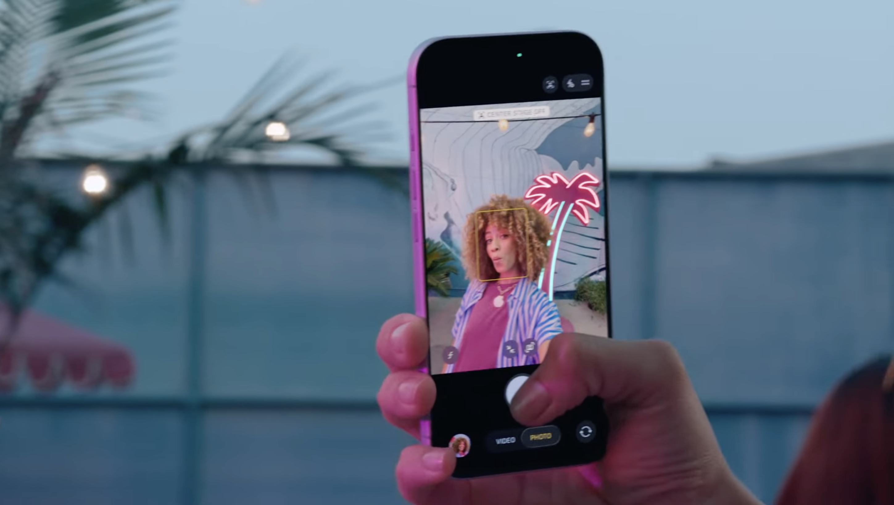 A picture of a woman using the new iPhone 17 Selfie Camera