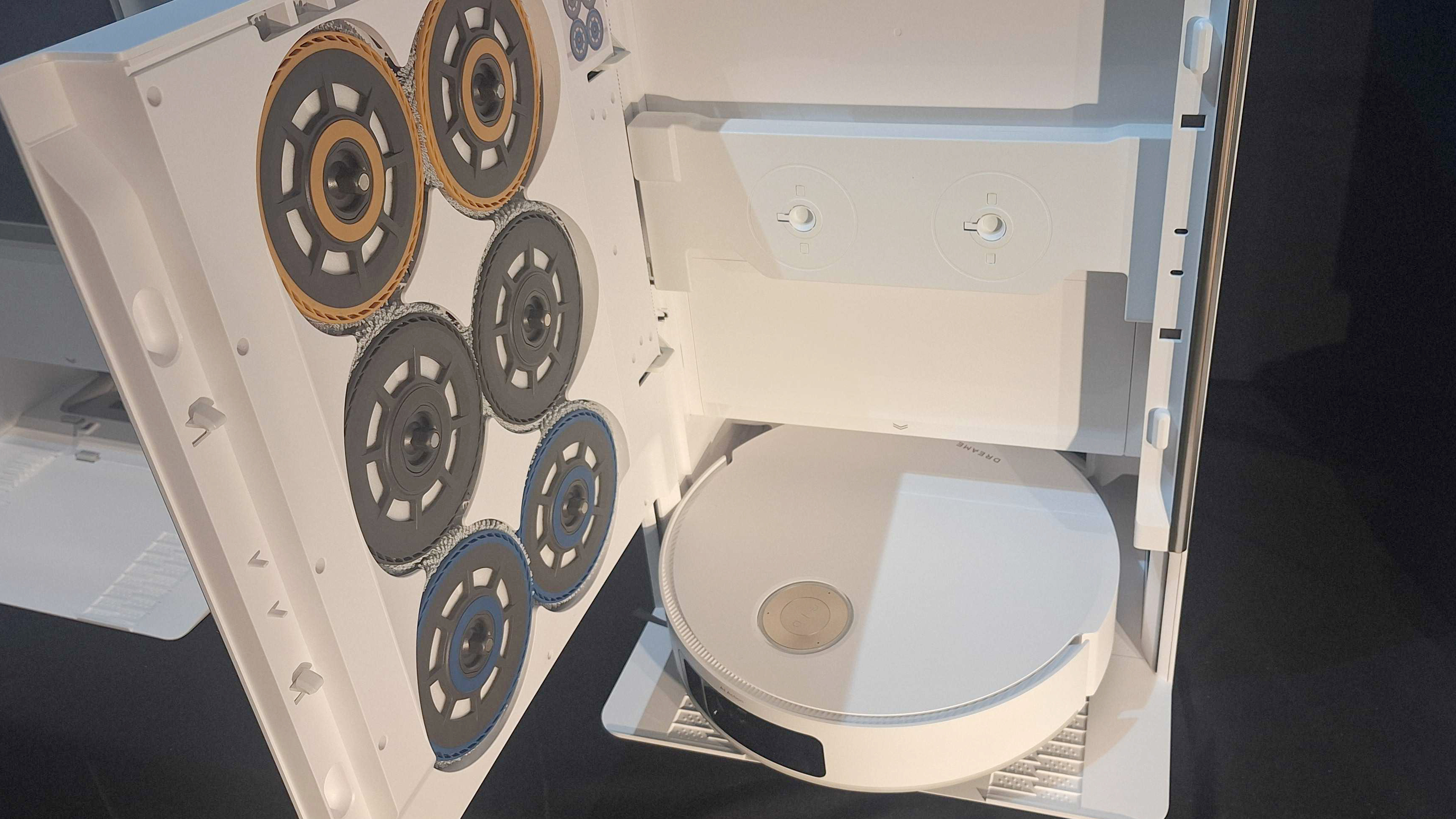 Photo showing the Dream Matrix10 Ultra's Dock with the door open, and reveals three sets of different mop pads