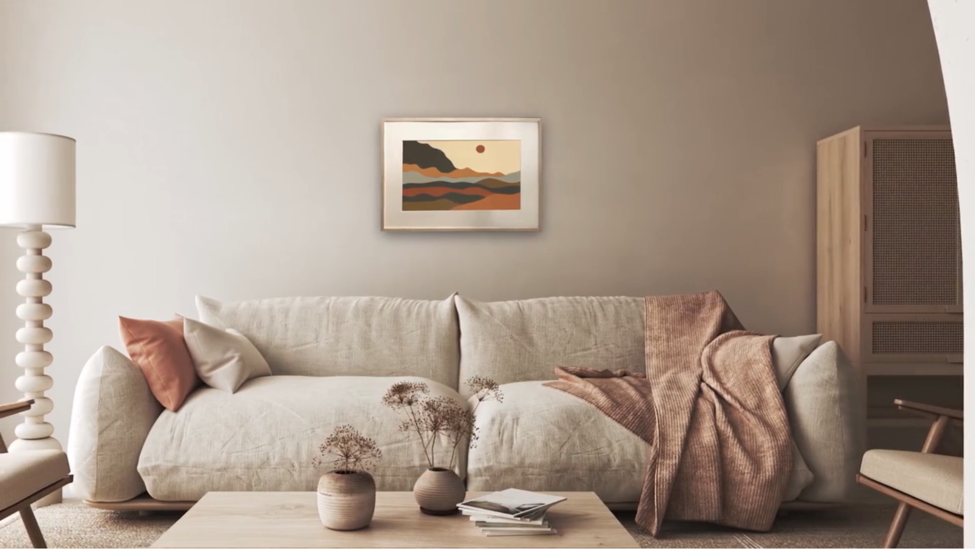 A living room wall showing a smart picture frame over a sofa