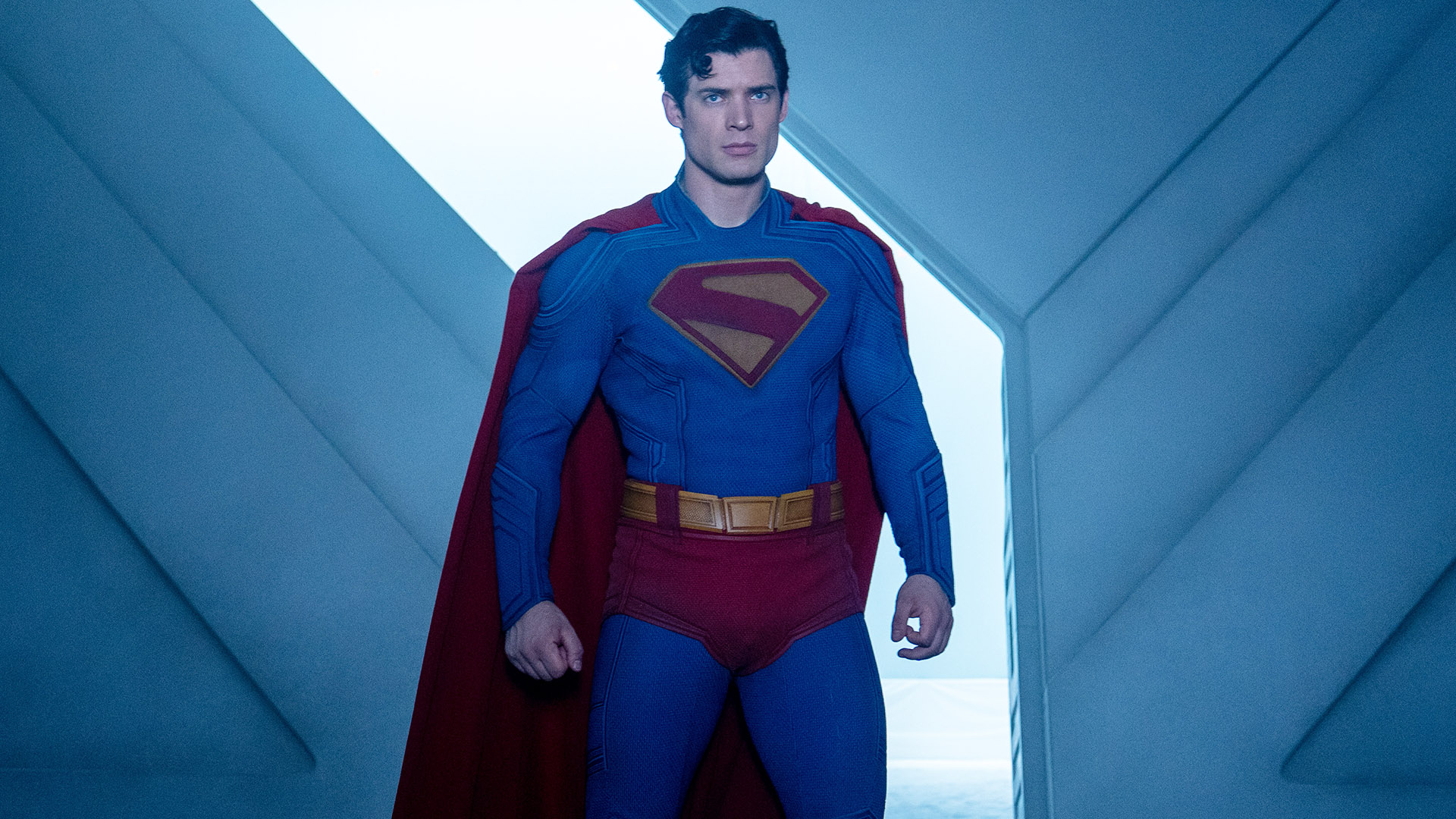 A strict looking Clark Kent that stands in the fortress of Loneliness in James Gunn's Superman movie