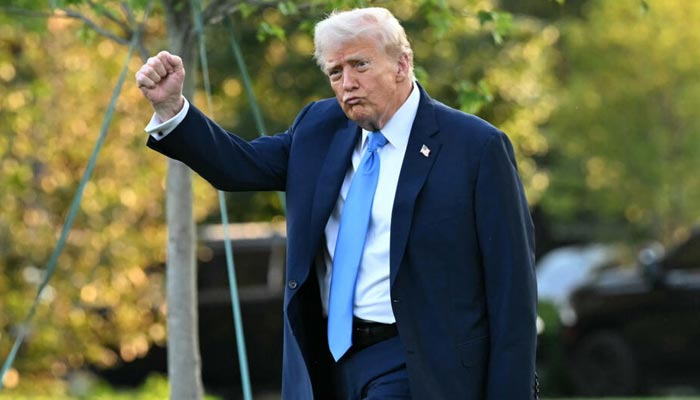 Donald Trump moves during an event in this undated photo. - AFP