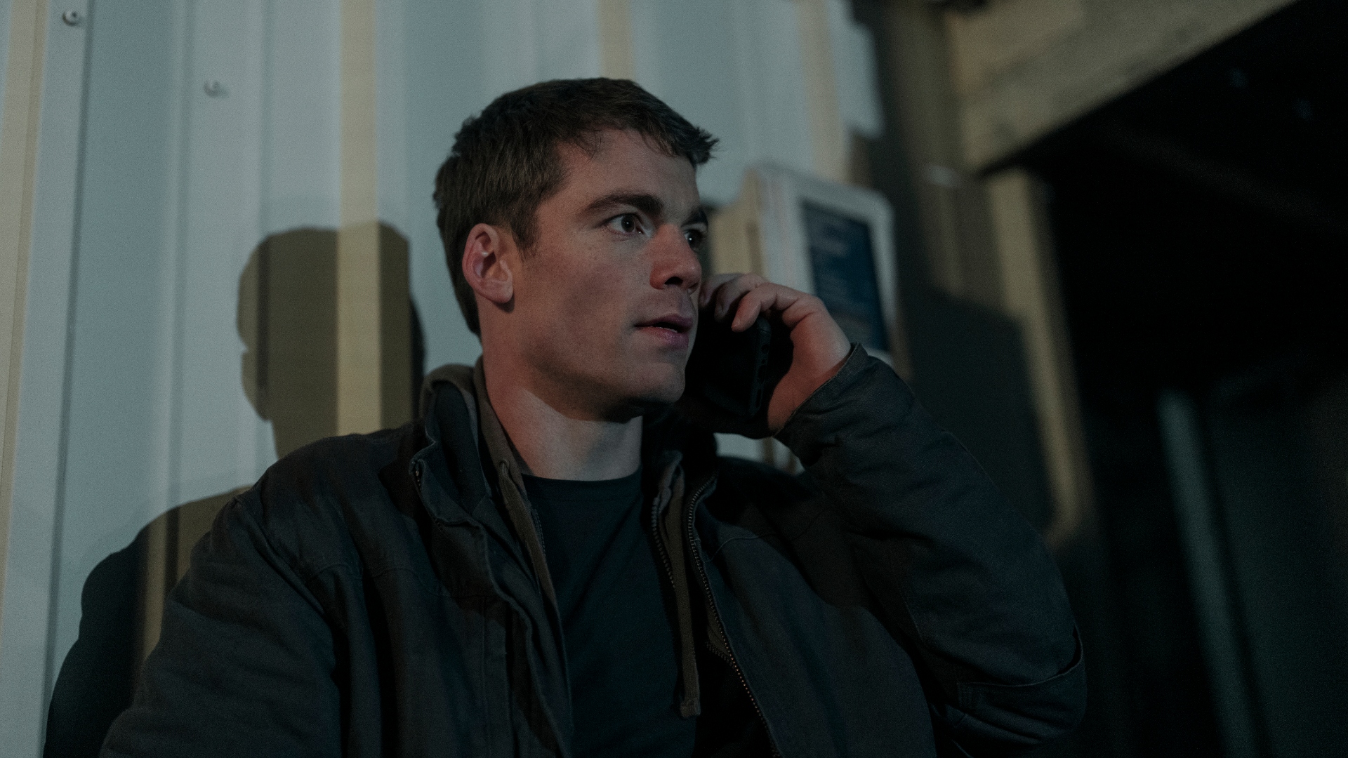 Peter talks on the phone at night agent