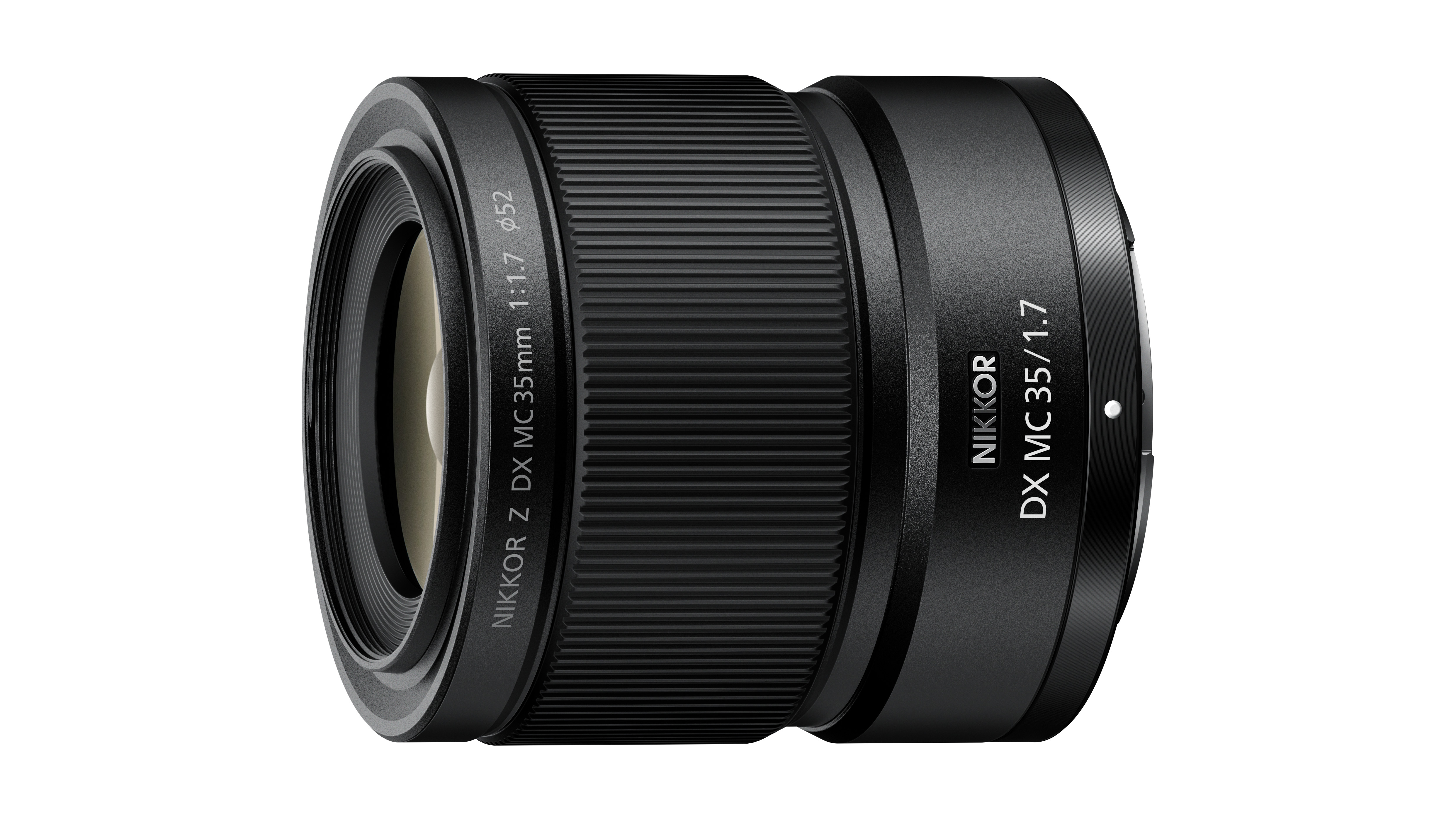 A NIKKOR Z DX MC 35mm f/1.7 macro lens on a white background
