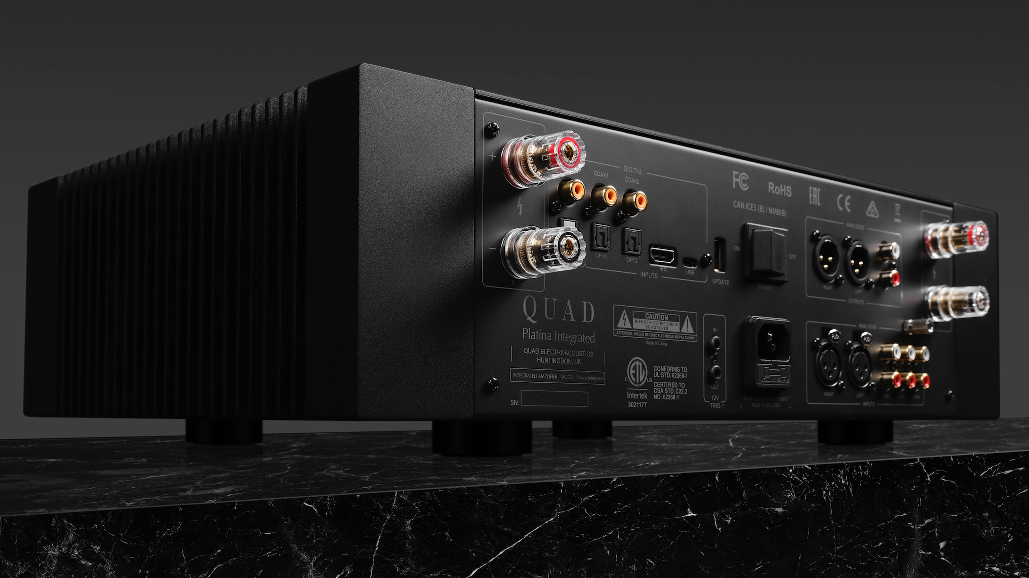 Rear view of Quad Platina integrated amplifier on a dark gray background