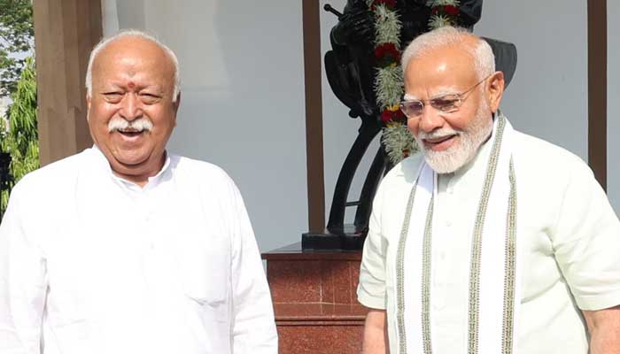 Indian Prime Minister Narendra Modi (right) pictured with RSS chief Mohan Bhatwat. — DD News/File