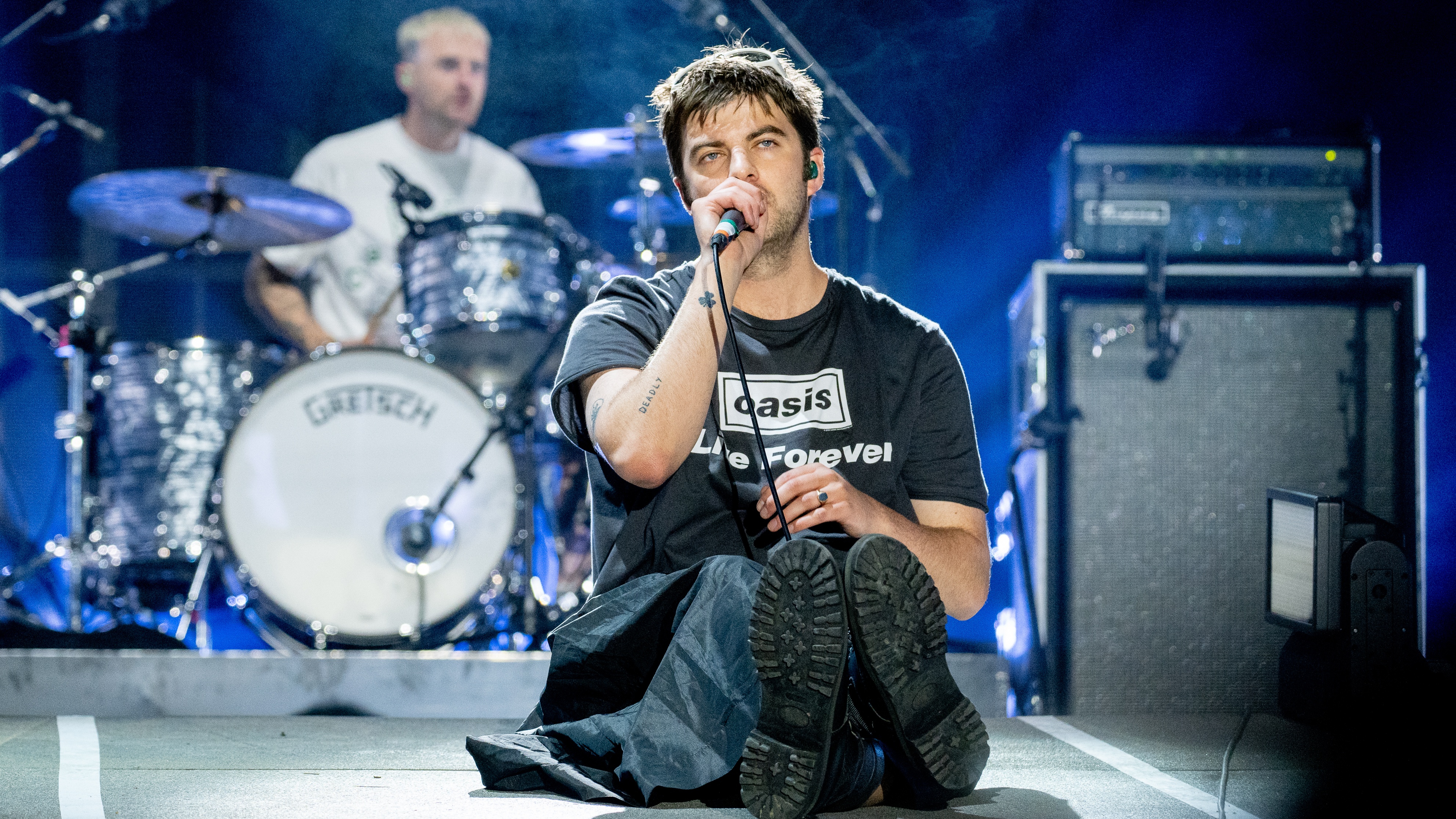 Grian Chatten and Tom Coll of Fontaines DC perform at Wythenshawe Park on August 15, 2025 in Wythenshawe, England.