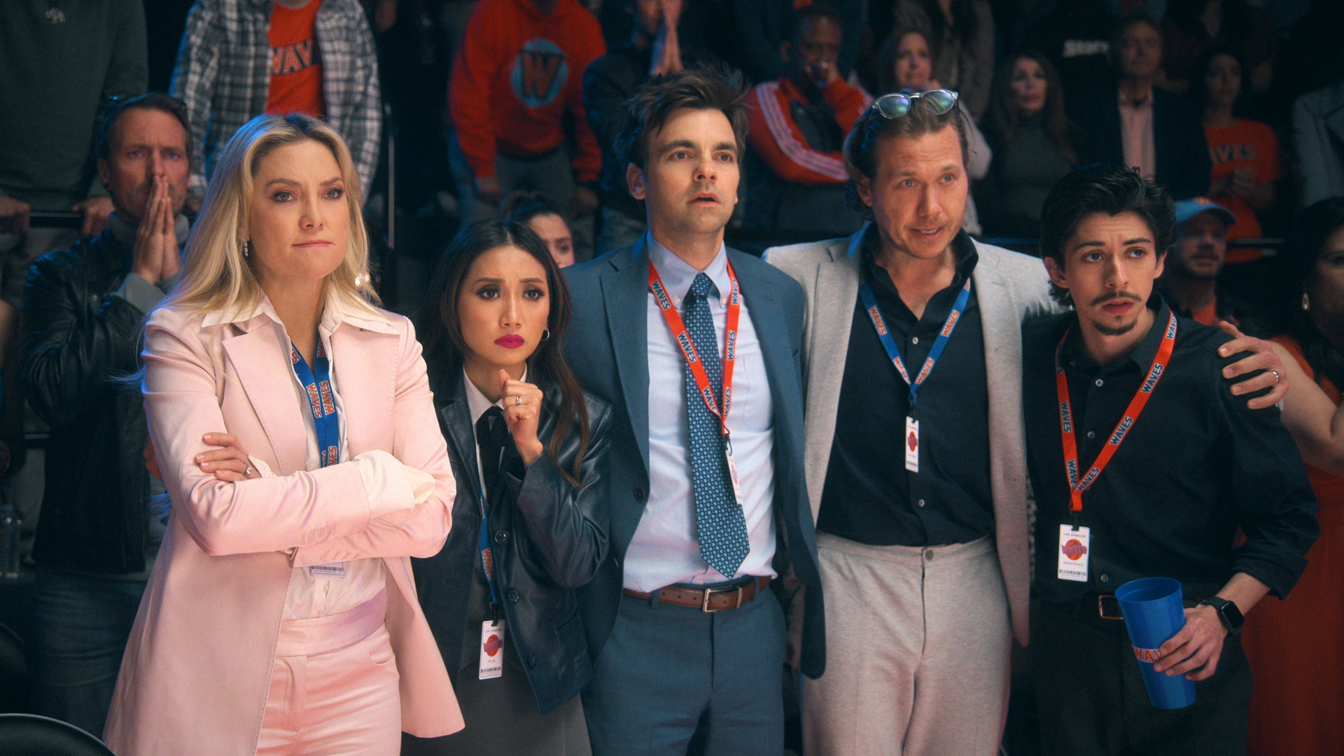 Isla and her team stand by the track in Running Point