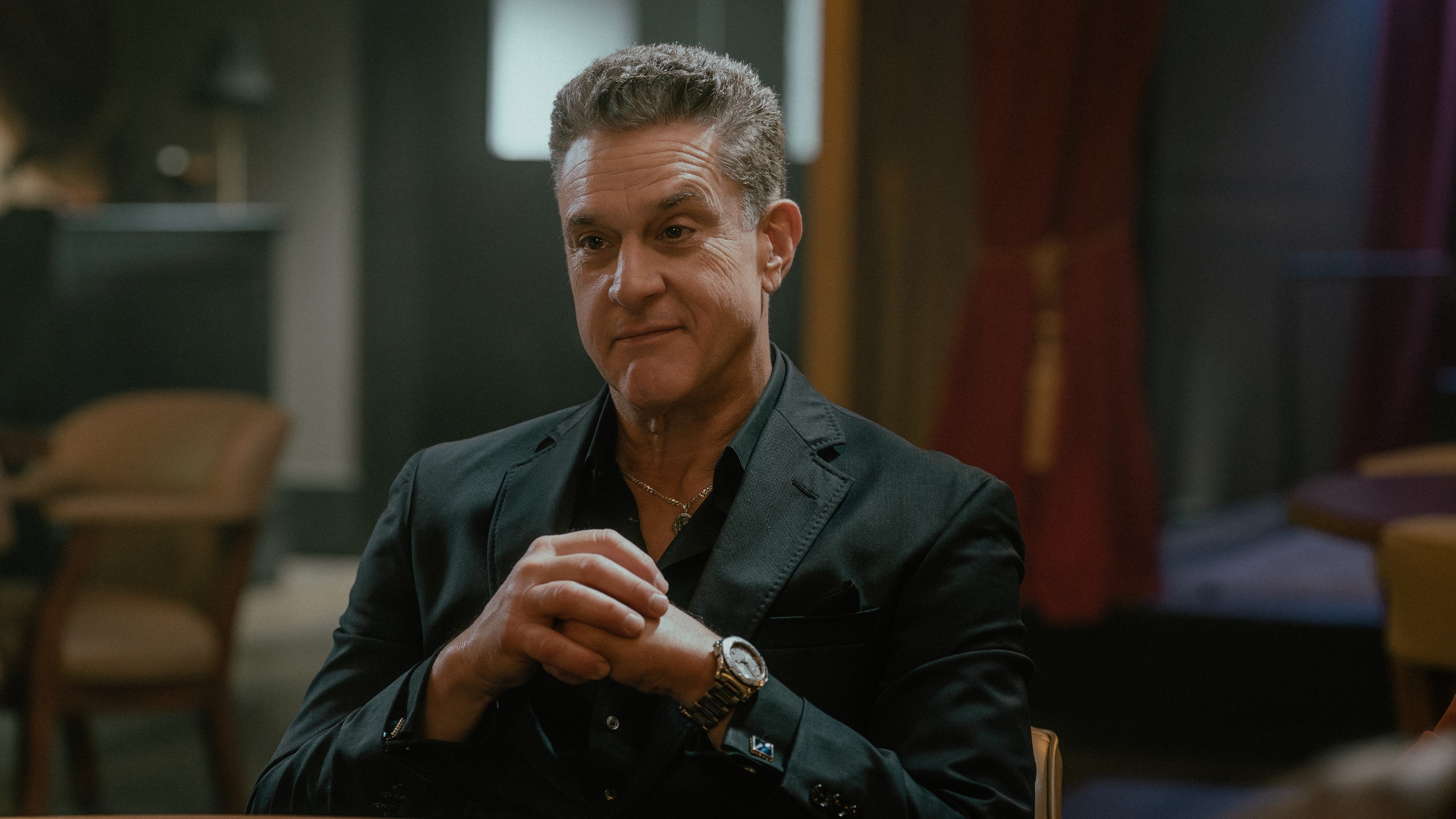 Goodie crosses his arms in Tulsa King Season 3