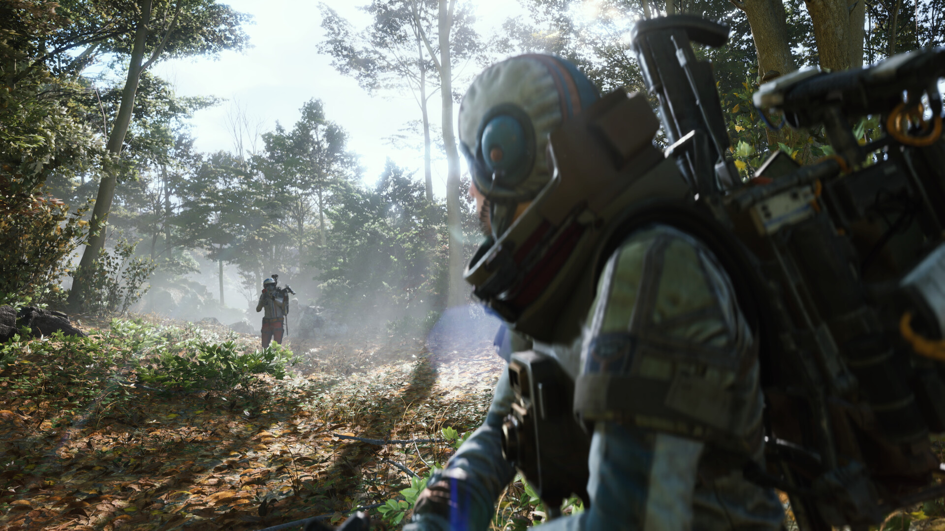 A soldier hides in a forest while an enemy approaches in the distance
