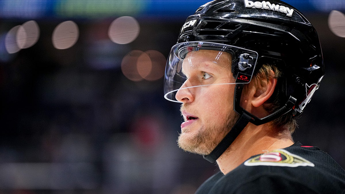 arthur kaliyev wearing a hockey helmet during the game